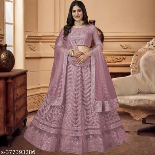 Pink net lehenga choli with sequins and embroidery, semi-stitched, Indian traditional bridal wear on mannequin