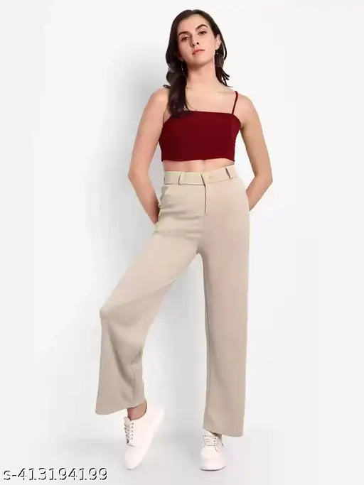 The woman is wearing beige straight fit pants