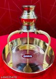 Shiny metal temple lamp, abhishek loti with a red base