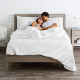 White cotton sateen bedsheet with pillow cover on a wooden bed frame. s5452958
