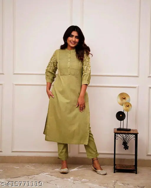 Multicolor embroidered cotton kurta set with pant, featuring solid print, mandarin collar, and three-quarter sleeves. Comfy fabric for versatile styling, perfect for casual wear or festivities. Indian origin