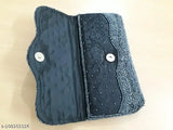 Black fabric with beading detail, two handles