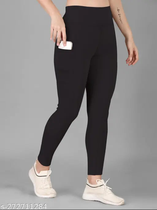 Black colorblocked active tights for women, polyester, solid net pattern. High-quality gymwear leggings with flexible fitting and comfort. Size 28 (waist 28in, length 34in), also available in sizes 30, 32, 34, 36, 38 (made in India)