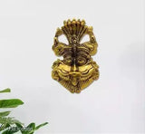 Metal Narsingh face wall hanging, evil eye protector, Feng Shui decorative showpiece from VK COLLECTION. 16 cm x 3.5 cm x 9 cm. Protects from negative energies and brings happiness and prosperity. Made in India