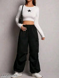Black high-waisted cargo pants with white stars on pockets