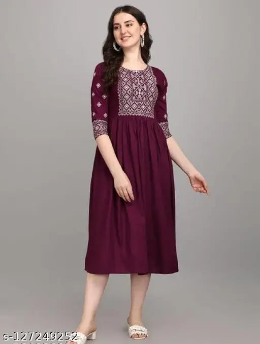 Purple embroidered kameez with long sleeves and front pockets, worn over a maroon skirt