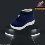 Navy blue shoes with white soles and whistle button