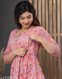 A woman in a floral print, pure cotton maternity gown with feeding gown features