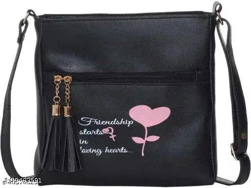 Black sling bag with pink heart design and zip closure