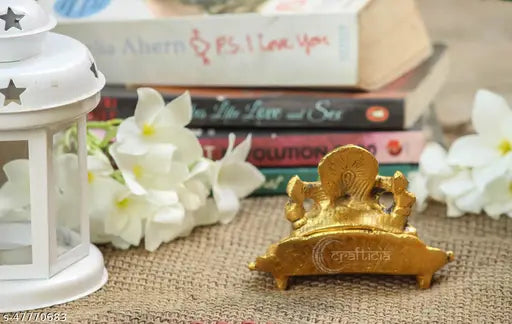 Gold oxide metal Ganesh idol with diya on leaf, 11x9.5x7 cm for puja and showpiece