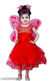 Little girl in red fairy costume, red puffy dress with wings and tiara