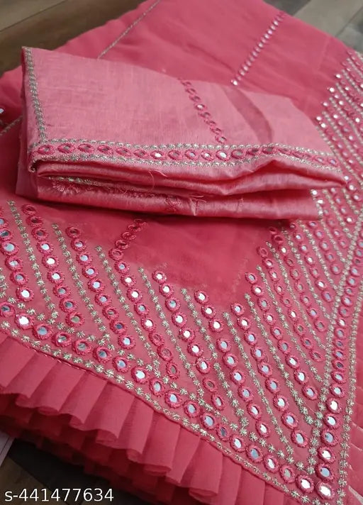 Red traditional sari, intricate zari work pallu, embellished with sequins and a large, elaborate pallu