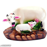 White poly resin Kamdhenu cow and calf idol for temple, home decor or car dashboard