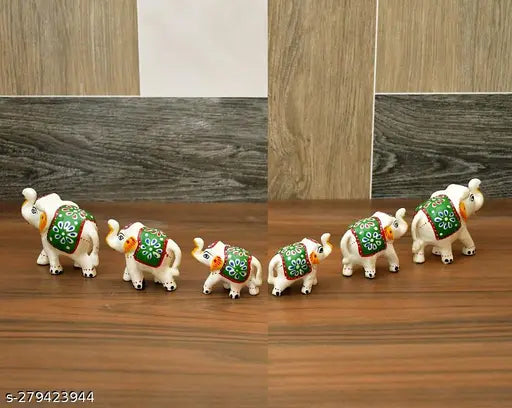 Handmade Rajasthani elephant figurine set (6 pcs), white and green paper mache for pooja room decoration. Great for home, office, or temple decor. Ideal gift for weddings, anniversaries, or festivals. Made in India