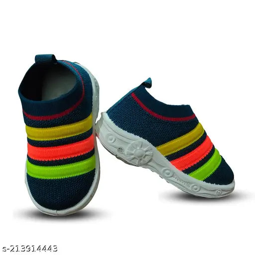 Blue, red, yellow, and black fabric shoes with a white sole and velcro closure for babies