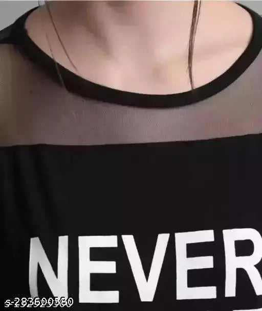 Black cotton crop top with unique Never Coast print and net fabric detail, perfect for casual wear