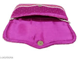 Beaded pink sequined clutch purse with a snap closure