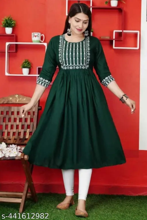 Dark green kameez with a detailed design and long sleeves