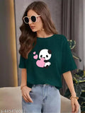 A person wearing a green oversized t-shirt with a cartoon graphic print