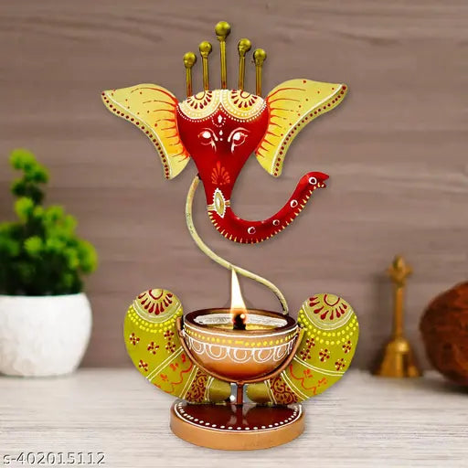Metal Ganesha Decorative T-Light Holder, intricately handcrafted from metal, adds spiritual elegance to sacred spaces, exuding tradition and modern aesthetics. Measures 3" x 6" x 11