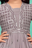 Purple polyester girls ethnic gown, embroidered net with three-quarter sleeves. Inspired by traditional Indian designs, perfect for special occasions
