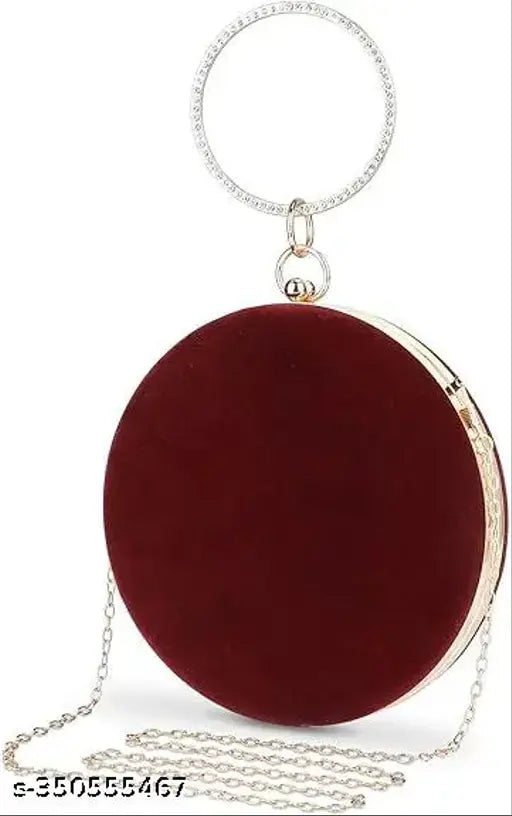 Velvet maroon clutch purse with chain strap and circular red accent