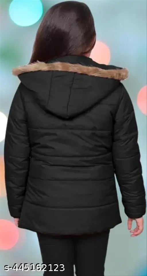 A young girl wearing a black puffy coat with a fur trimmed hood
