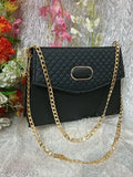 Quilted PU ladies' handbag with golden chain strap, black with gold trim