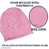 Pink knitted cap with a floral design on the front, made from wool