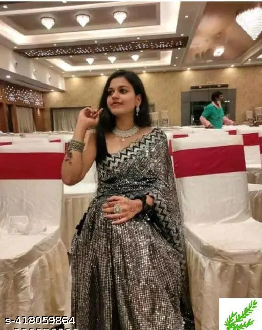 Grey sequin saree woman seated event banquet