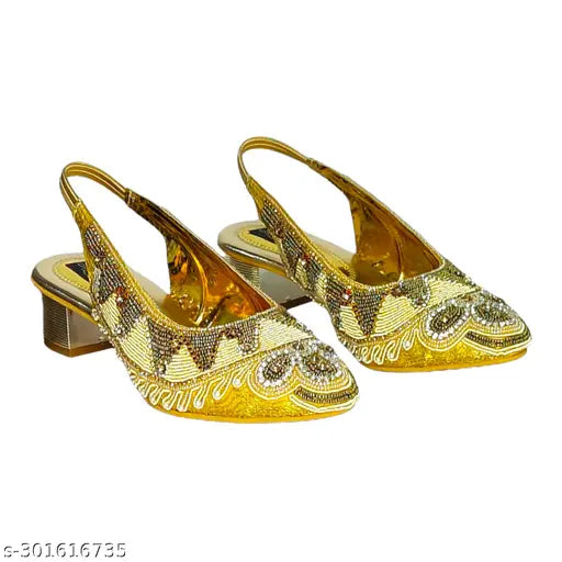 Synthetic gold embellished belly sandals for women, showcasing unique Indian design and excellent finish. Available in sizes: IND-5, IND-6, IND-7, IND-8, IND-9, IND-10