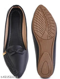 Black leather slippers with white stitching and gold zipper pull tab