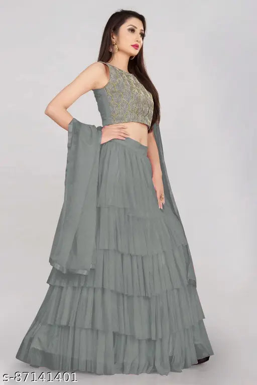 Embroidered satin lehenga set in net fabric, ruffle design, semi-stitched, free size up to 42 inch. Indian women's fashion accessory