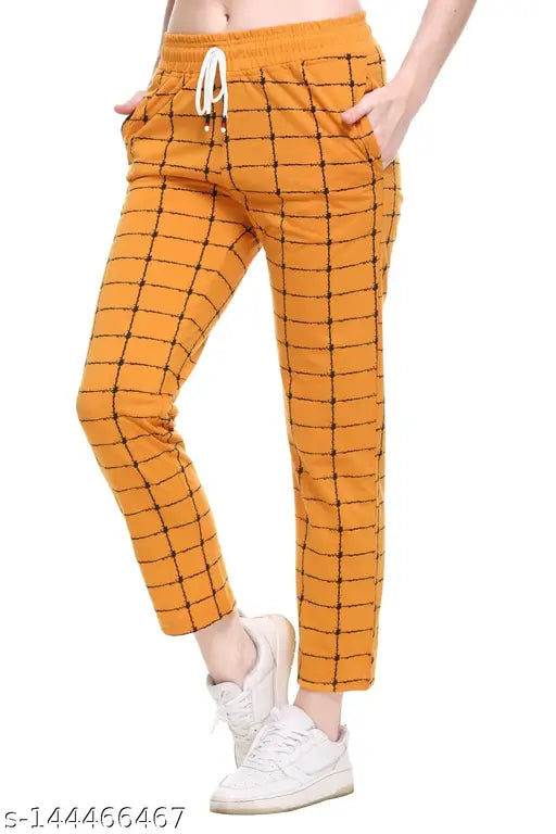Orange women's track pants with chevron pattern