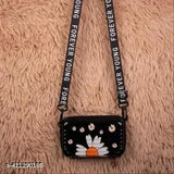 Black sling bag for women, featuring a flower design and a black strap