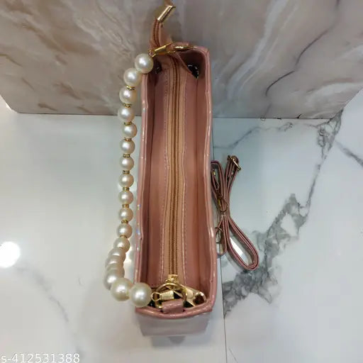 Pink sling bag, chain strap, with pearls and a keychain