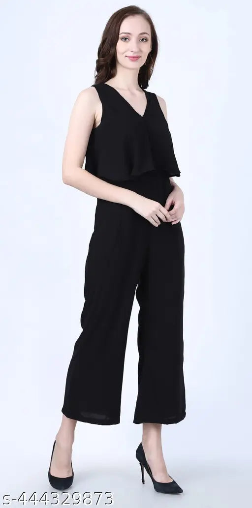 Black cotton blend solid-color full-length sleeveless jumpsuit for women and girls, featuring a V-neck and two side pockets, ideal for homewear, shopping, beach, vacation, or any outdoor activities. Made in India