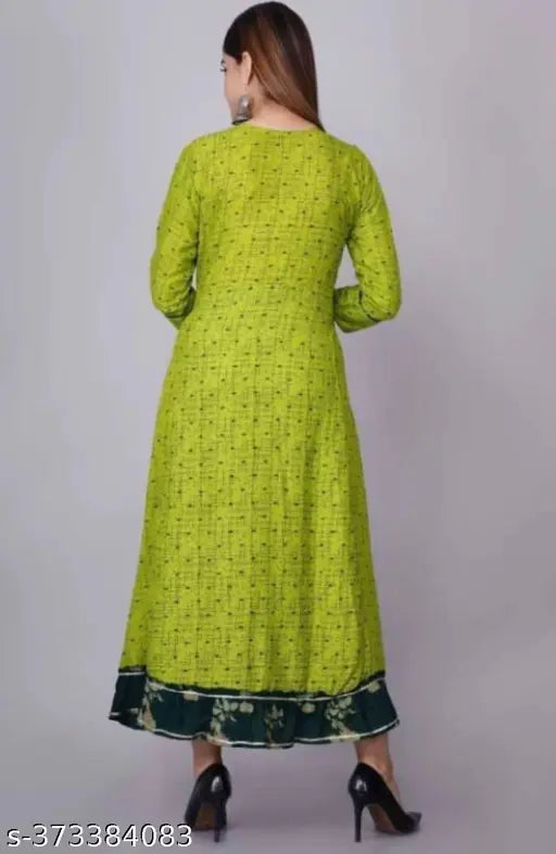 Green rayon anarkali kurti with three-quarter sleeves, printed combo, modest neckline, subtle embroidery, and ankle length. Made in India