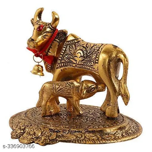 Golden metal Hindu Kamdhenu cow and calf statue, fulfilling wish for prosperity