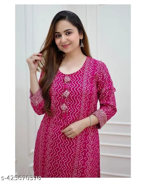 Rayon, three-quarter sleeve pink Bandhani print Kurta with flared design, Indian ethnic fashion for women on display