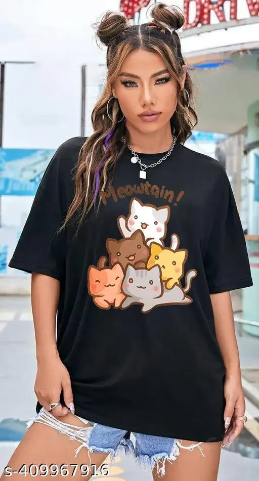 Oversized black t-shirt with cat graphic and text, baggy fit for women, beige background