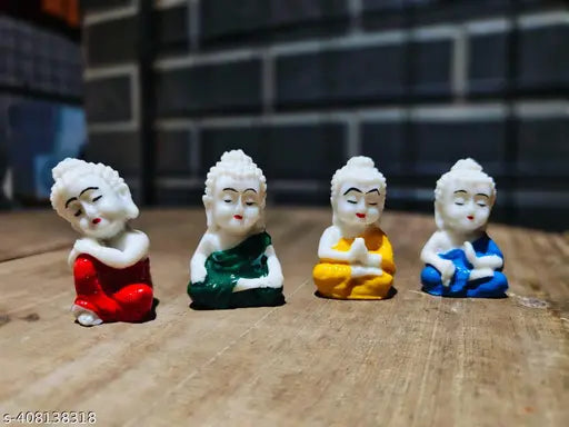 White resin Buddha statue set of 4, intricately detailed, compact home decor pieces from India