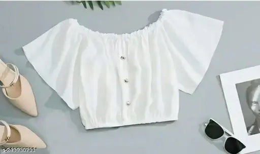 White lace blouse with ruffled sleeves, matching skirt, in a stylish fashion set