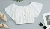 White lace blouse with ruffled sleeves, matching skirt, in a stylish fashion set
