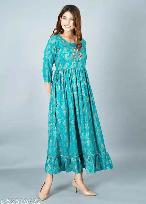 Teal sari with puffed sleeves and flared hem