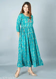 Teal sari with puffed sleeves and flared hem