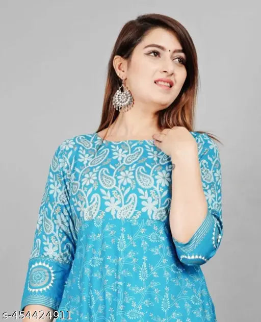 A woman wearing a blue kurta with floral embroidery