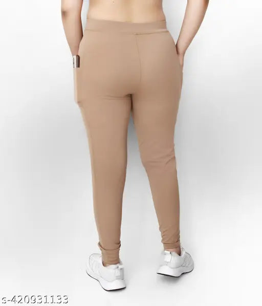 Trendy beige polyester women's pocket jeggings, high-waisted and stretchy for everyday wear