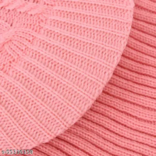 A trendy pink monkey beanie cap with snow proofing and visor