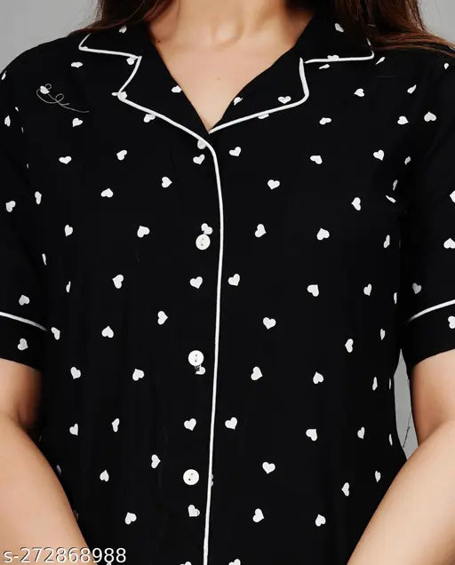 Women's black rayon printed nightsuits with short sleeves and matching pyjama bottoms, featuring intricate design on display